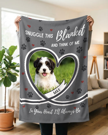 Personalized grey pet photo blanket held up in a bright living room