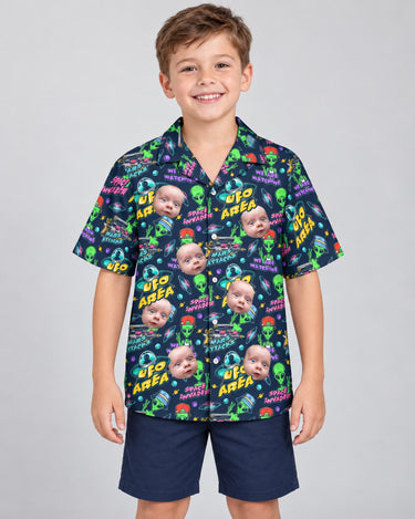 Alien Invasion Hawaiian shirt with printed faces, worn by a child