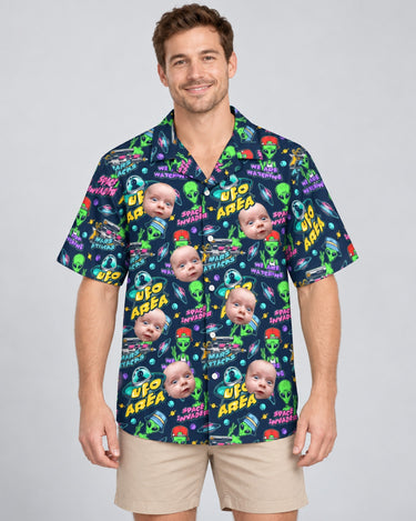 Alien Invasion Hawaiian shirt with printed faces, worn by a man