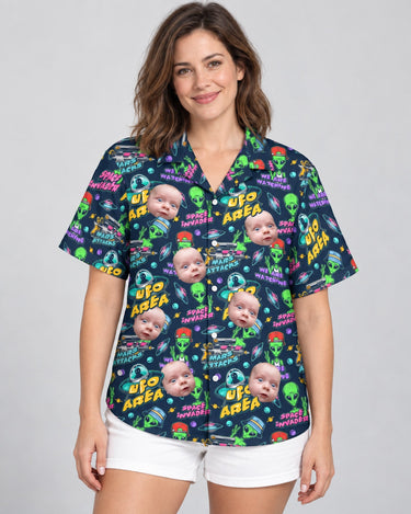 Alien Invasion Hawaiian shirt with printed faces, worn by a woman