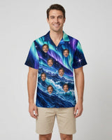 Aurora Waves Christmas Hawaiian Shirt with printed faces, worn by a man