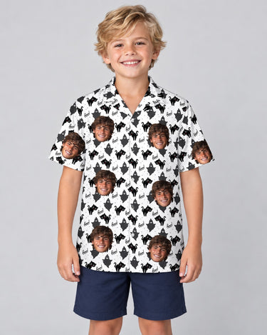 Black Cat Silhouette Halloween Hawaiian shirt with printed faces, worn by a child