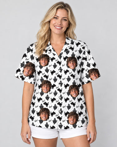 Black Cat Silhouette Halloween Hawaiian shirt with printed faces, worn by a woman