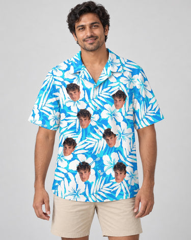 Blue Hibiscus Breeze Hawaiian shirt with printed faces, worn by a man
