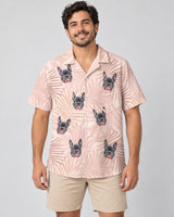 Blush Tropics Hawaiian shirt with printed faces, worn by a man