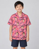Bright Colorful Tropical Florals Hawaiian shirt with printed faces, worn by a child