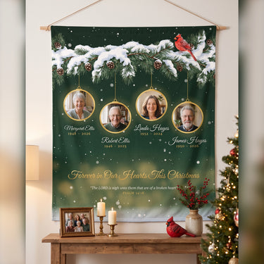 Christmas memorial blanket with 4 photos hung on the wall above a console with candles, Forever in Our Hearts This Christmas