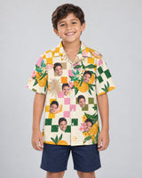Citrus Splash Hawaiian shirt with printed faces, worn by a child