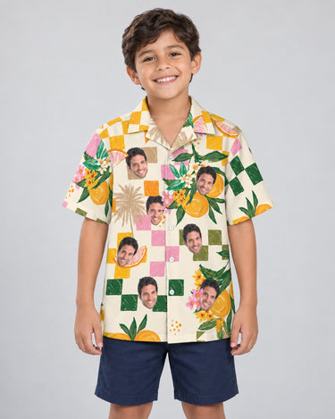 Citrus Splash Hawaiian shirt with printed faces, worn by a child