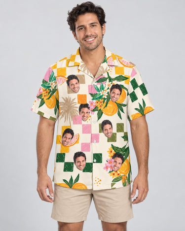 Citrus Splash Hawaiian shirt with printed faces, worn by a man