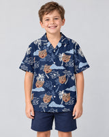 Coconut Palm Delight Hawaiian shirt with printed faces, worn by a child