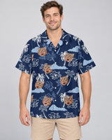 Coconut Palm Delight Hawaiian shirt with printed faces, worn by a man