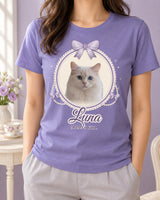 Violet coquette pet photo shirt with a white cat in a cream lace cameo, lavender ribbon bows, ivory pearl strands and the script name Luna.