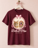 Maroon coquette pet cameo shirt on an ivory hanger against a blush wall, showing two pets, cherry red satin bows, pearl strands and the name Bella & Max.