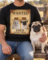 Adult cropped below the chin with a fawn pug at a ranch bench, wearing a black Wanted pet photo shirt featuring that same pug and a white cat in cowboy hats.