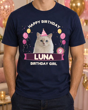 Navy pet birthday shirt with a white cat in a striped hat, pink and gold balloons, age 9 rosette, Luna ribbon and Birthday Girl lettering.