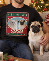 An adult cropped below the chin with a fawn pug beside a Christmas tree, wearing a black pet photo tee with the same pug and Nordic knit motifs