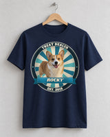 Navy custom pet vintage badge t-shirt on a wooden hanger with a corgi in a blue and teal sunburst badge and the name Rocky on a ribbon