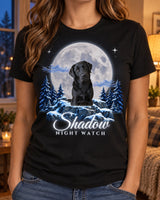 Woman wearing a black custom pet moon t-shirt with a black Labrador under a silver-blue moon and the name Shadow in glowing script
