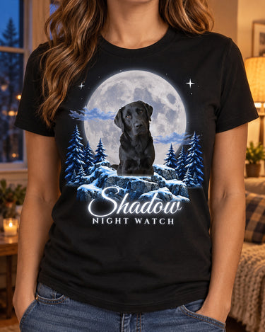 Woman wearing a black custom pet moon t-shirt with a black Labrador under a silver-blue moon and the name Shadow in glowing script