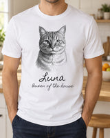 Man wearing a white custom cat sketch t-shirt with a pencil portrait of a tabby cat and the name Luna in handwritten script, with the line Queen of the house