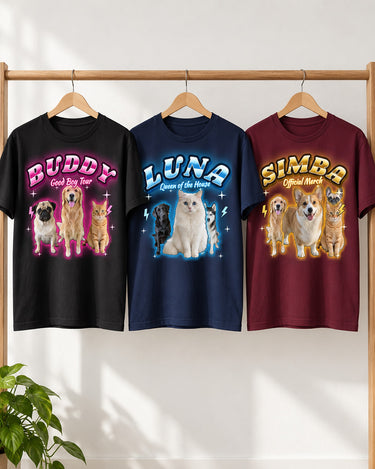 Three custom pet bootleg t-shirts on a clothing rail in black, navy and maroon with pink, ice blue and gold glow