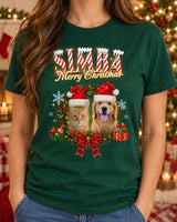 Woman wearing a forest green custom pet Christmas t-shirt with the name Simba in candy-cane lettering and a dog and a cat in Santa hats inside a holly wreath