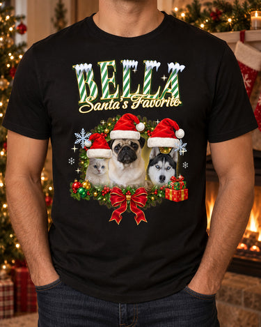 Man wearing a black pet Christmas t-shirt with the name Bella in mint green candy-cane lettering and three pets in Santa hats inside a holly wreath