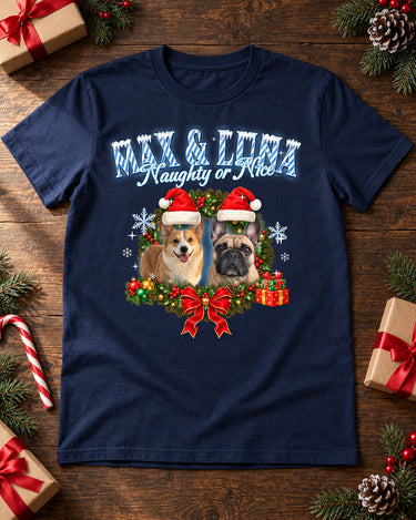 Navy pet Christmas t-shirt laid flat with gift boxes, pine branches and a candy cane, the name Max and Luna in icy blue lettering with two dogs in Santa hats
