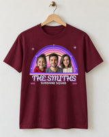 Maroon vintage sunset photo tee on a wooden hanger, showing three portraits inside purple and pink rainbow arcs with THE SMITHS and Sunshine Squad.