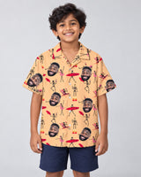 Dead Surfer Skeleton Hawaiian shirt with printed faces, worn by a child