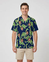 Dino Lights Dinosaur Christmas Hawaiian Shirt with printed faces, worn by a man
