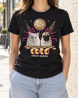 Black custom disco pet photo shirt worn on a bright city street, showing a pug and white cat beneath a gold mirror ball with the name Coco.