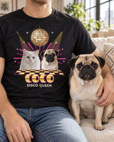 Adult with a fawn pug in a bright loft, wearing a black disco pet tee with pet portraits, a gold checkerboard floor and Disco Queen lettering.