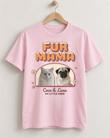 Light pink FUR MAMA photo shirt on a wooden hanger, with a pug and white cat inside a sunset arch, daisies, hearts and Coco & Luna in script.