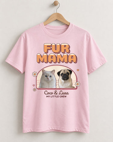 Light pink FUR MAMA photo shirt on a wooden hanger, with a pug and white cat inside a sunset arch, daisies, hearts and Coco & Luna in script.