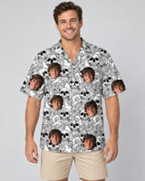 Edgy Skull Surf Hawaiian shirt with printed faces, worn by a man