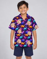 Electric Neon Dinosaur Hawaiian shirt with printed faces, worn by a child