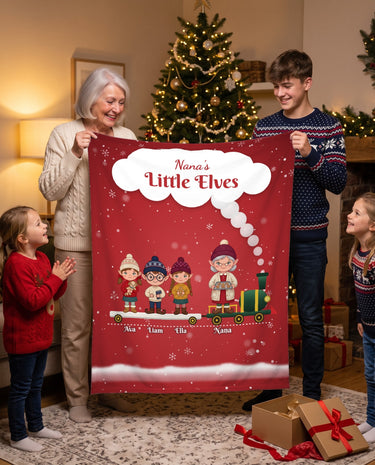 Nana's Little Elves personalized grandma blanket with grandkids names, red elf train design held by grandma