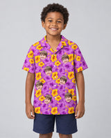 Enchanted Hibiscus Garden Hawaiian shirt with printed faces, worn by a child