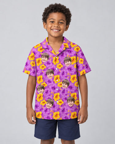 Enchanted Hibiscus Garden Hawaiian shirt with printed faces, worn by a child