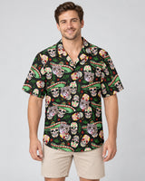 Fiesta Skull Vibes Hawaiian shirt with printed faces, worn by a man