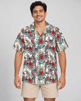 Floral Macaw Magic Hawaiian shirt with printed faces, worn by a man