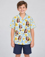 Frangipani Paradise Hawaiian shirt with printed faces, worn by a child
