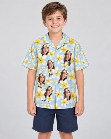 Frangipani Paradise Hawaiian shirt with printed faces, worn by a child