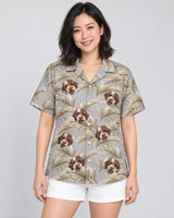 Golden Palm Leaves Hawaiian shirt with printed faces, worn by a woman