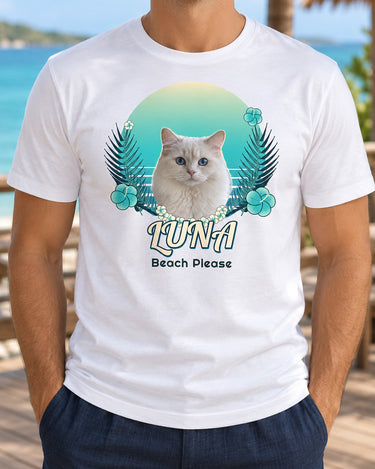 White custom tropical cat photo T-shirt showing Luna with a cream flower lei, turquoise Ocean Breeze sunset, hibiscus flowers and Beach Please text.