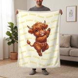 Personalized Highland cow dancing blanket in lemon cream held up in a living room, with the name Emma repeated in soft waves