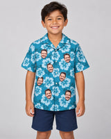 Hibiscus Island Dreams Hawaiian shirt with printed faces, worn by a child