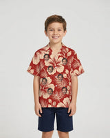 Hibiscus Woodcut Christmas Hawaiian Shirt with printed faces, worn by a child